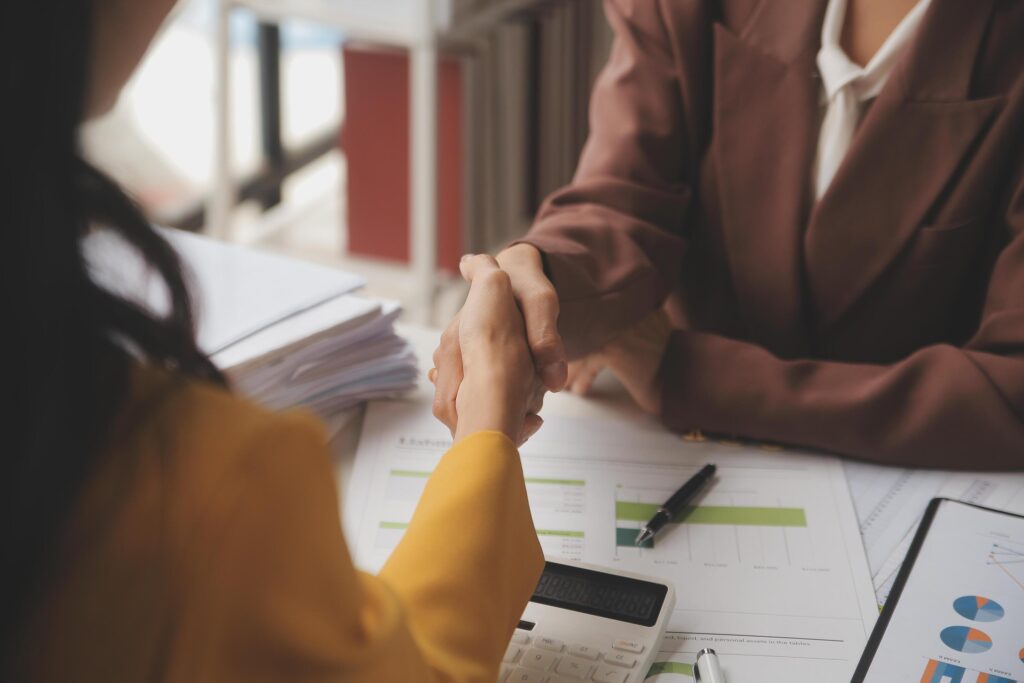 Teamwork executives colleagues business people handshake after meeting Stock Free