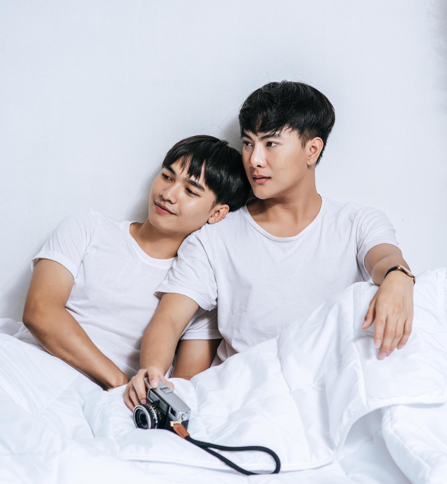 Two beloved young men slept in bed together. Stock Free