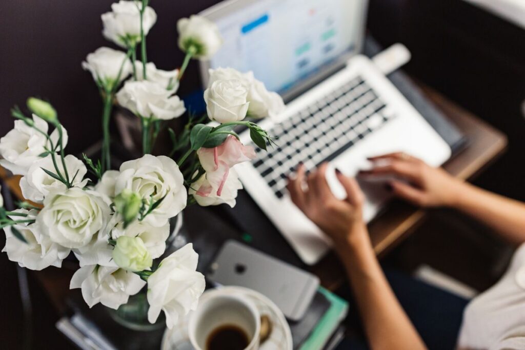 
									Woman working on laptop at home office Stock Free