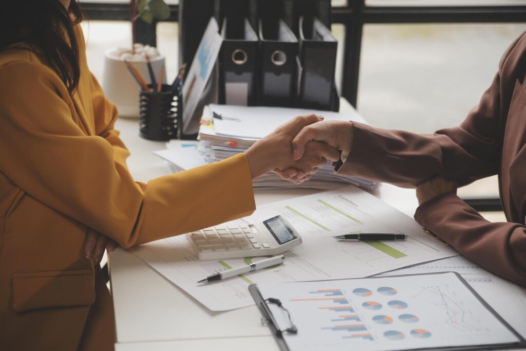 Teamwork executives colleagues business people handshake after meeting Stock Free