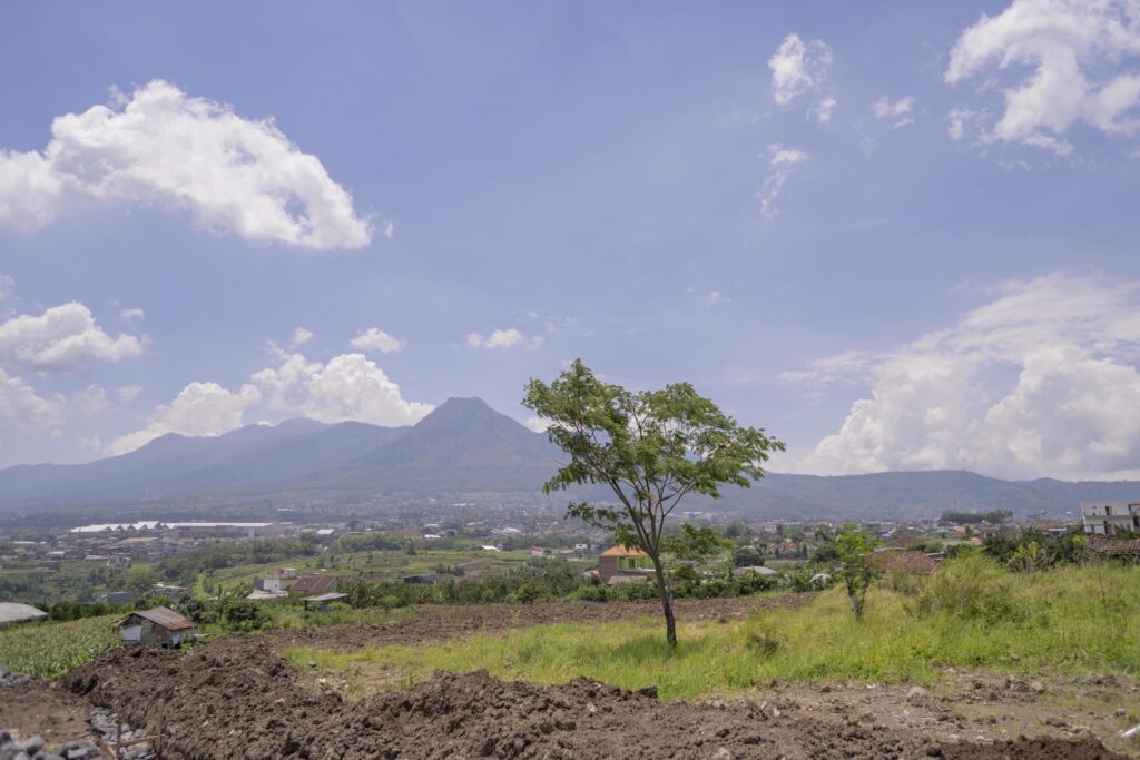 Landscape scene mountain tree and blue sky with cloudy. The photo is suitable to use for nature background, environment poster and nature content media. Stock Free