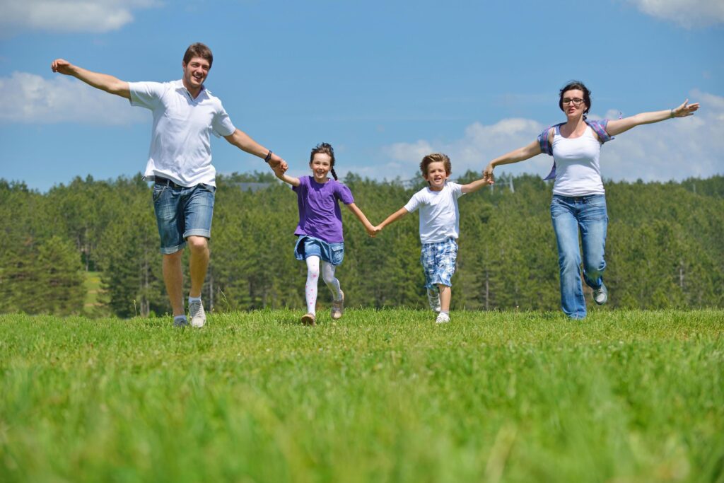 happy young family have fun outdoors Stock Free