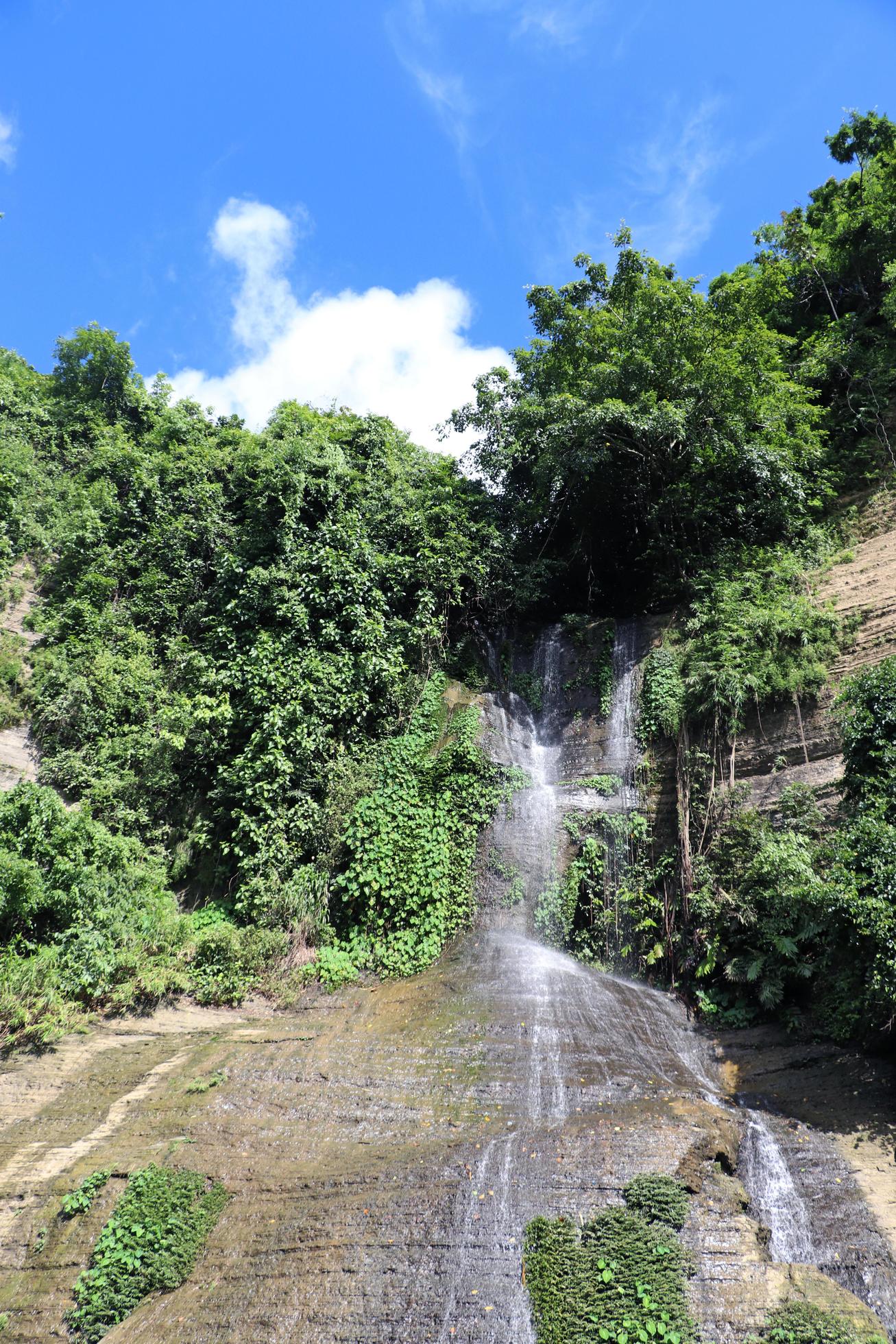 Natural waterfall view in the forest or mountain. Beautiful sky view with the mountain. green mountain with clouds Stock Free