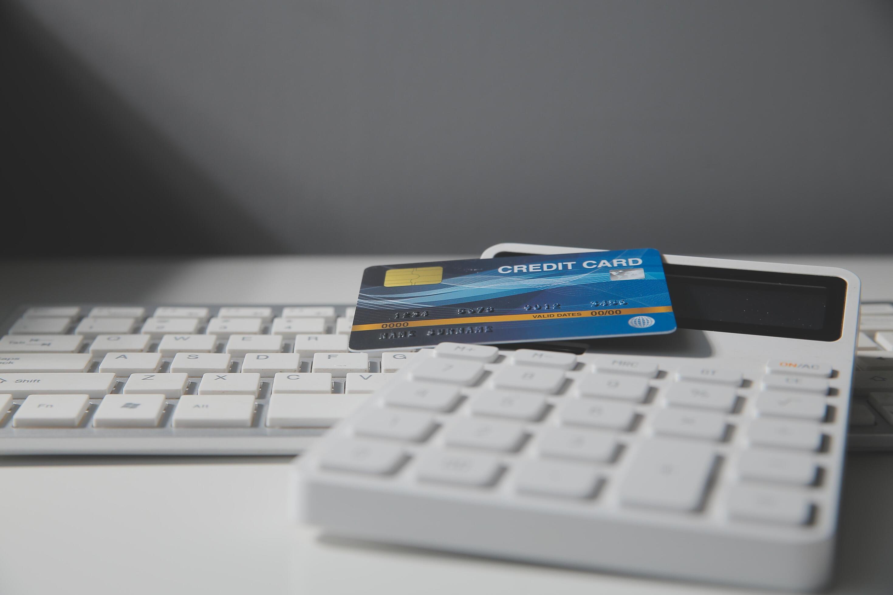 Calculator on a dark background, plastic cards and banknotes Stock Free