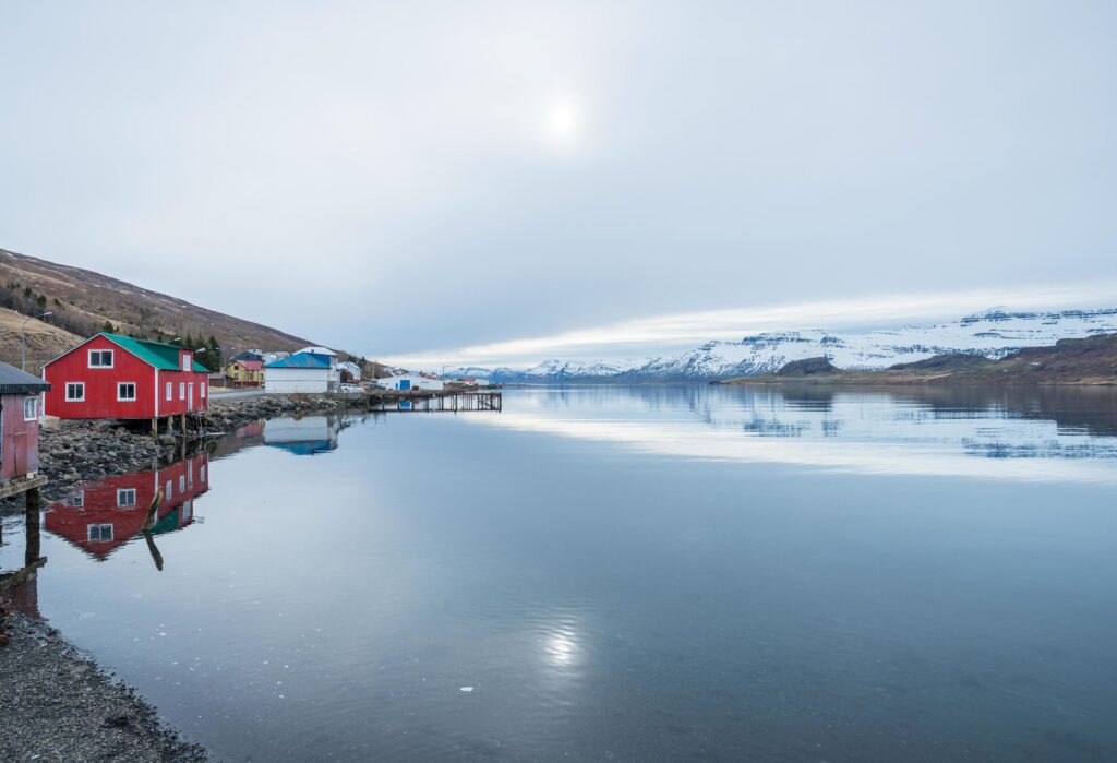 The reflection of the nature in Eskifjordur the small village of East fjord of East Iceland. Stock Free