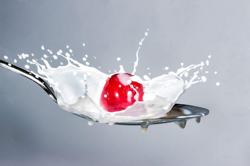 Red Splashing Water Against White Background Stock Free