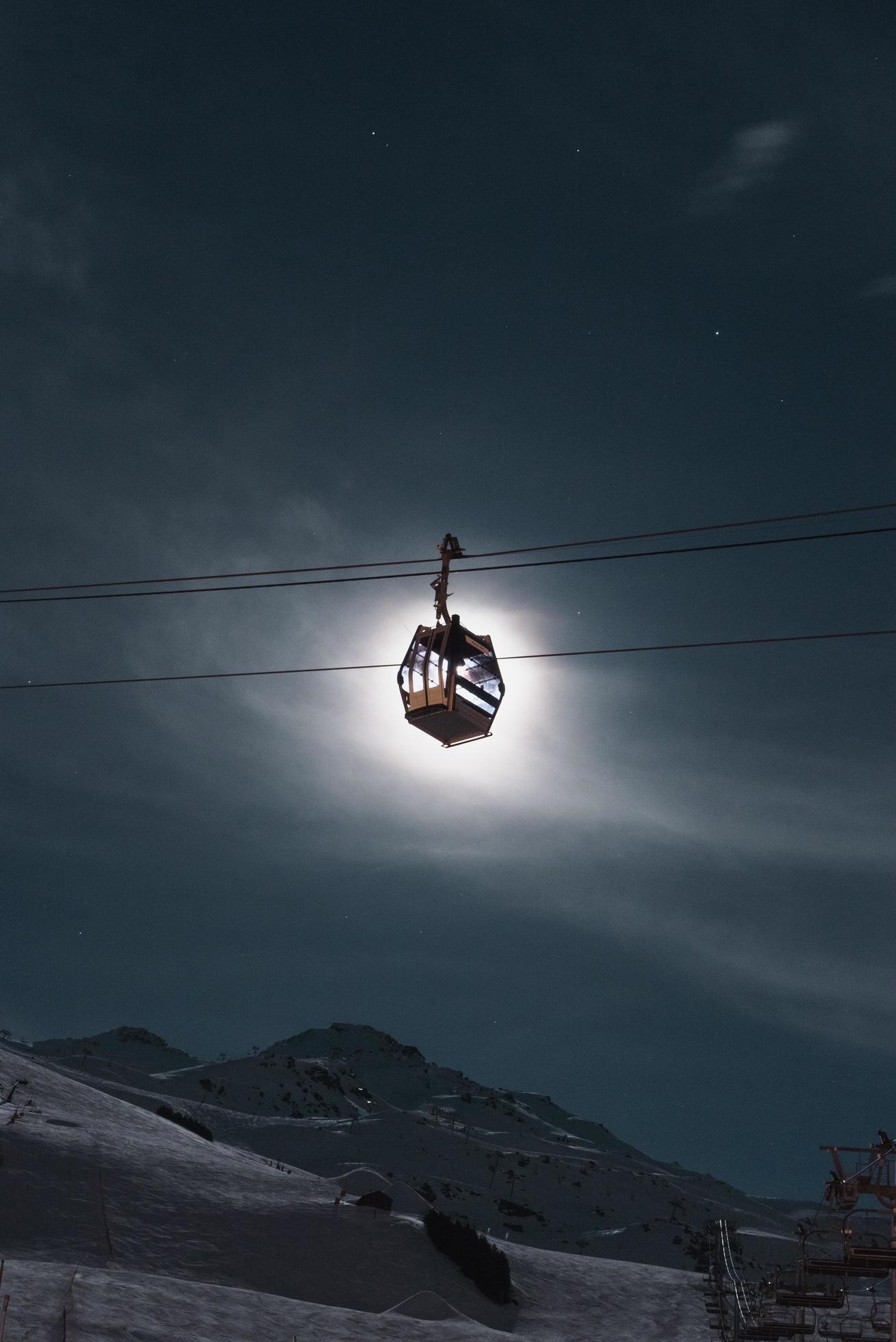 Cable ride in front of the moon Stock Free