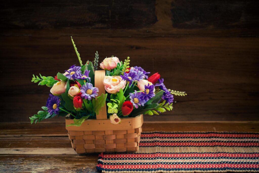 still life flower in basket on old wood Stock Free