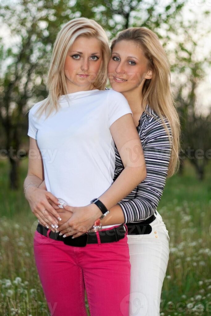 Portrait of two smiling lovely young women Pro Photo