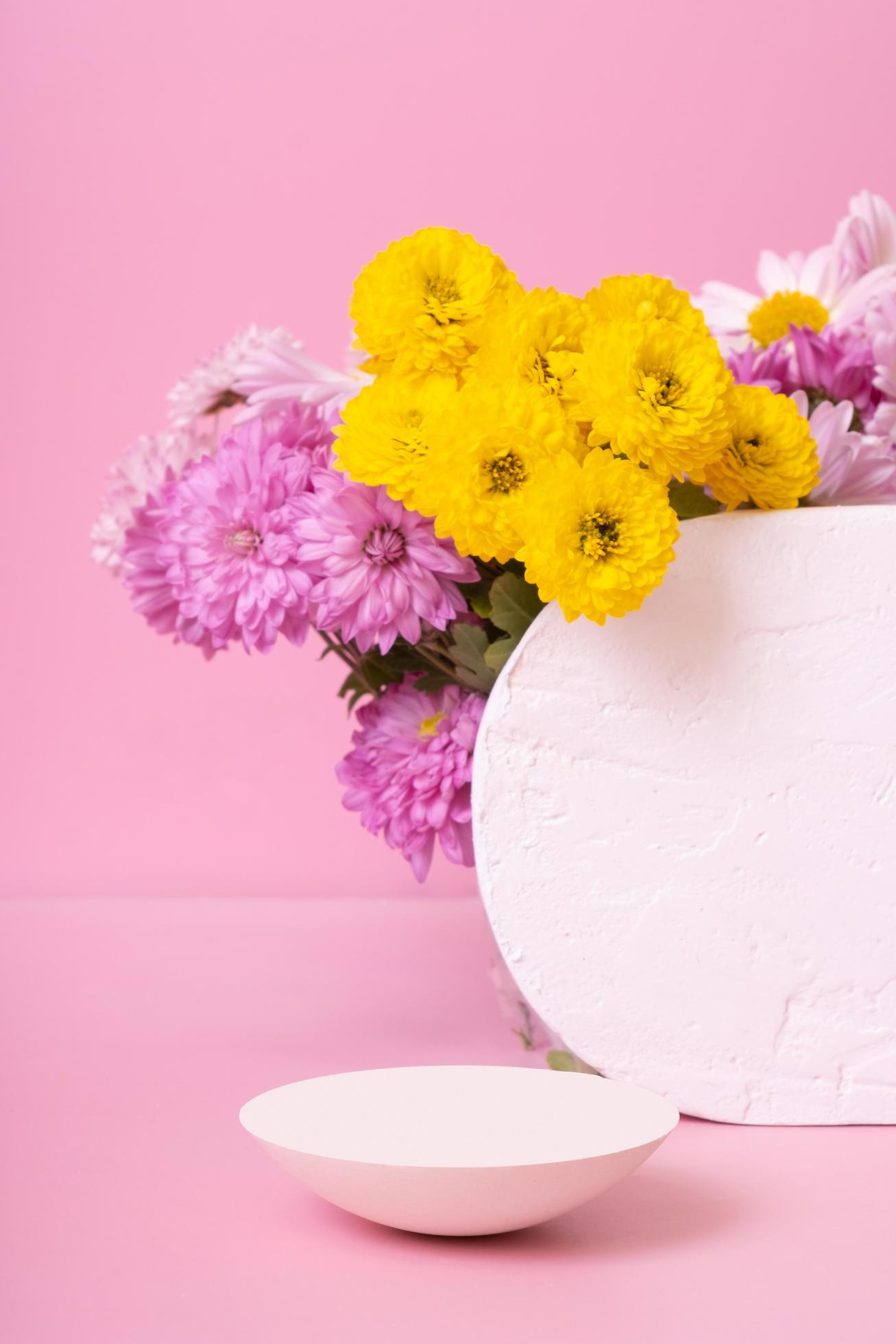 Podium or pedestal with chrysanthemum flowers. Mockup for your cosmetic products Stock Free