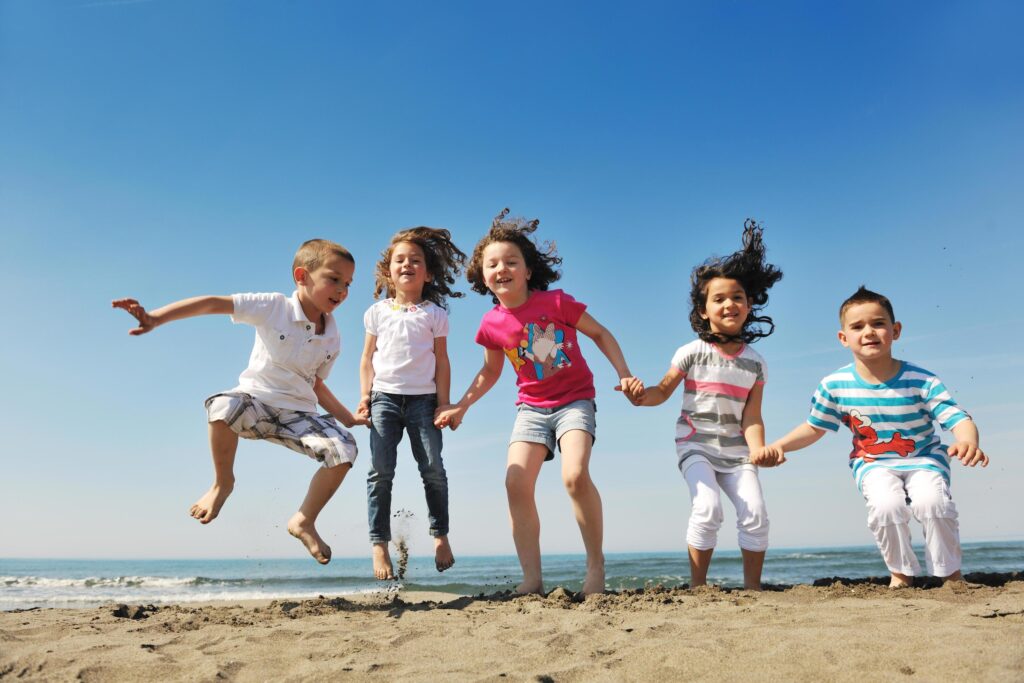 happy young people group have fun on beach Stock Free