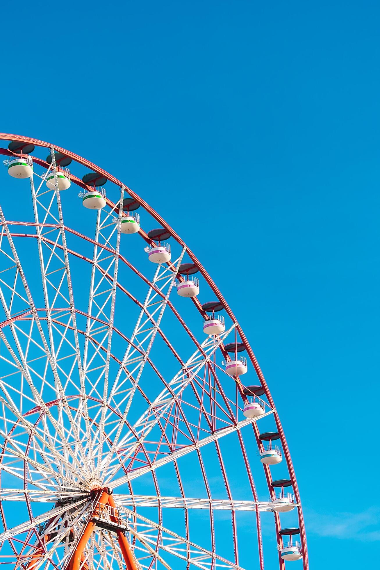 View of the Ferris wheel attraction against a background of blue sky. Ferris wheel in the Georgian city of Batumi. Stock Free