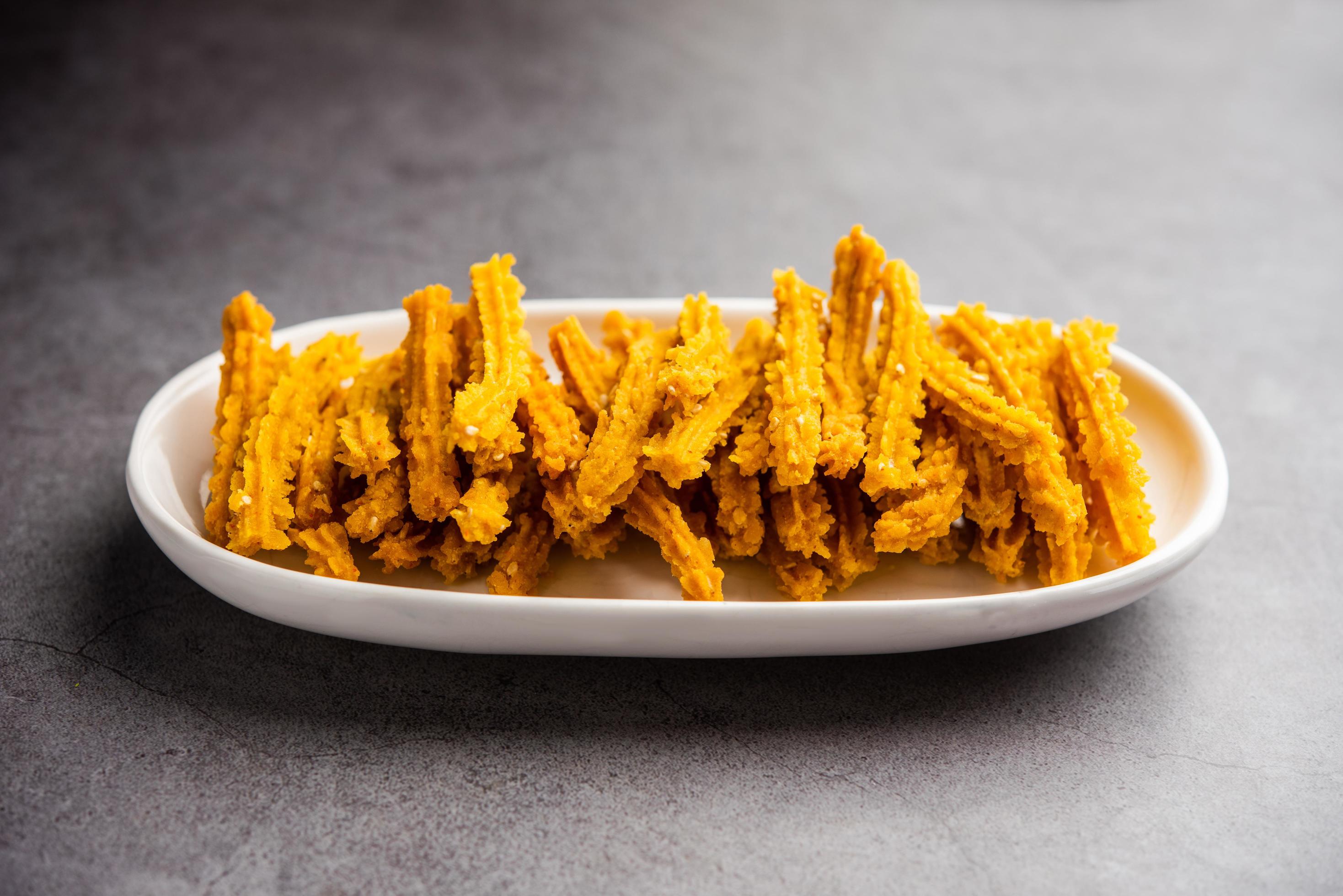 Bhajni chakli sticks or crunchy murukku snack made using diwali festival, favourite munching food Stock Free