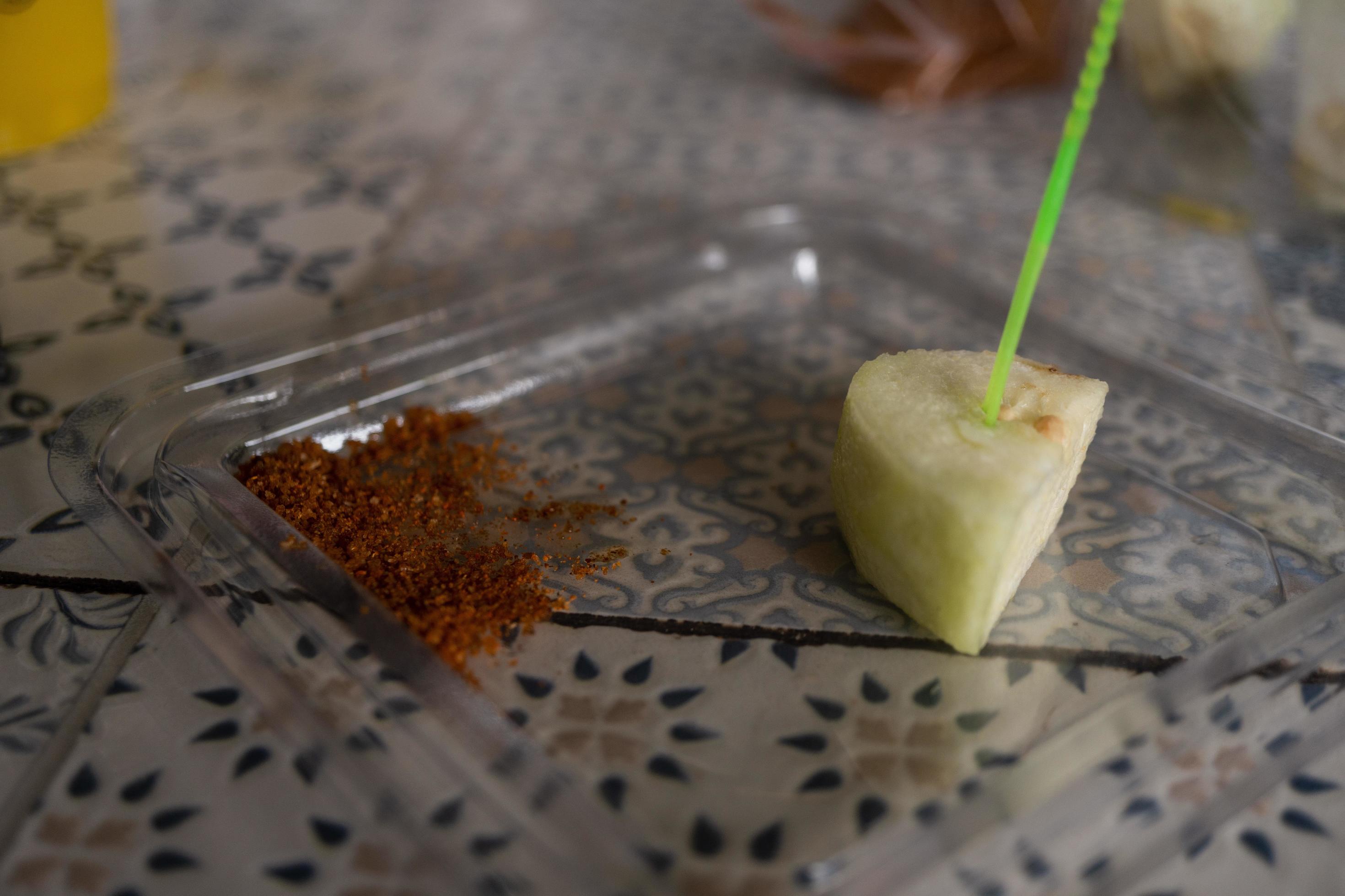 Traditional fruit salad with chili powder on the cafe shop. The photo is suitable to use for traditional food background, poster and food content media. Stock Free