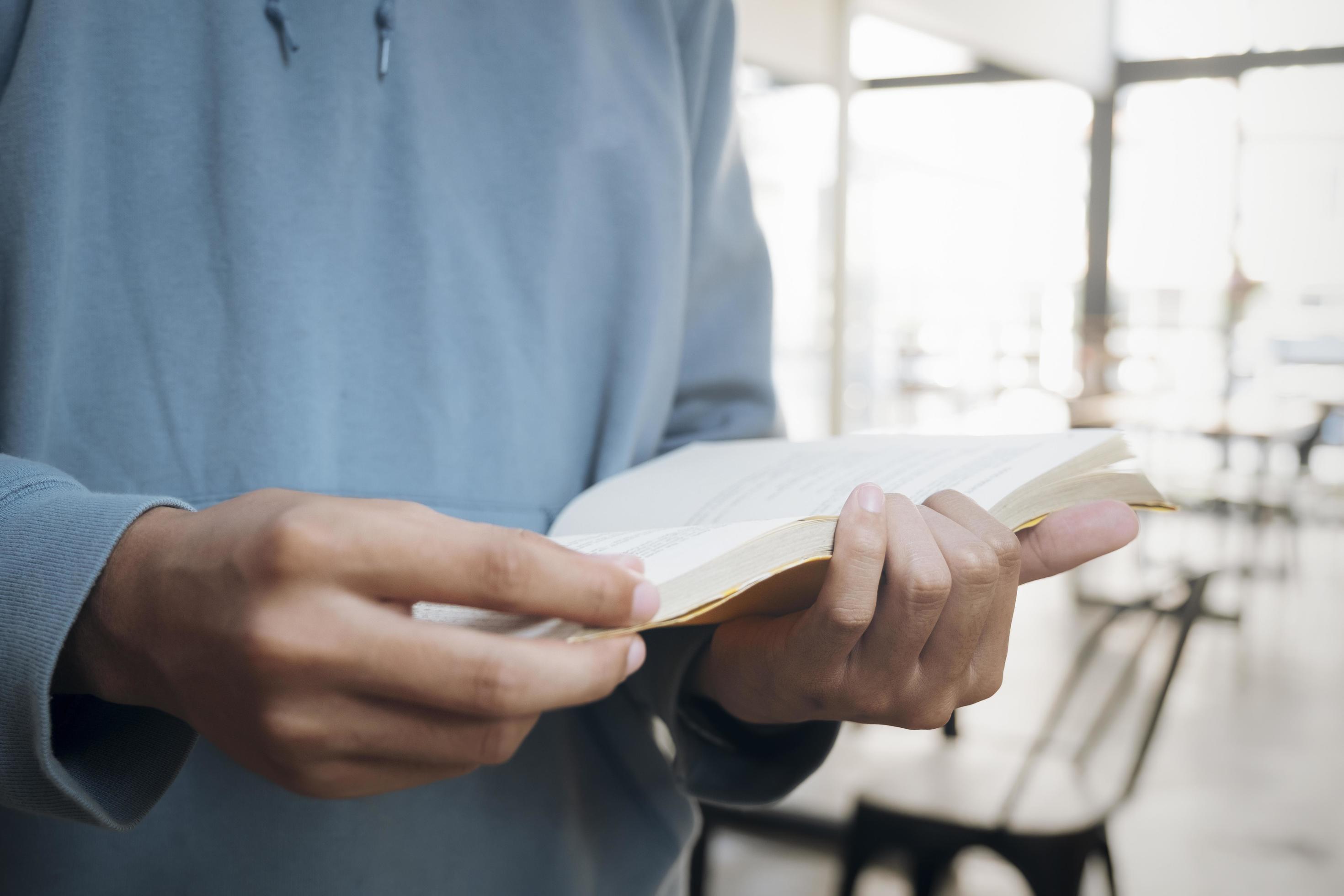 Close-up of a man reading a book Stock Free