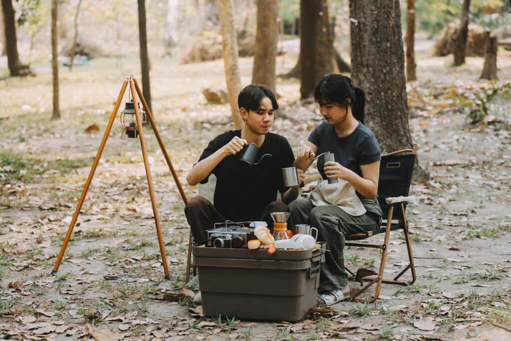 Asian couple sweet in tent inside on they camping trip, traveller relax and sleep togather in out door and camping trip Stock Free