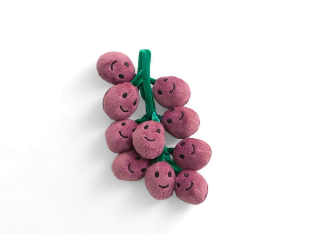 red grape doll on white background Stock Free