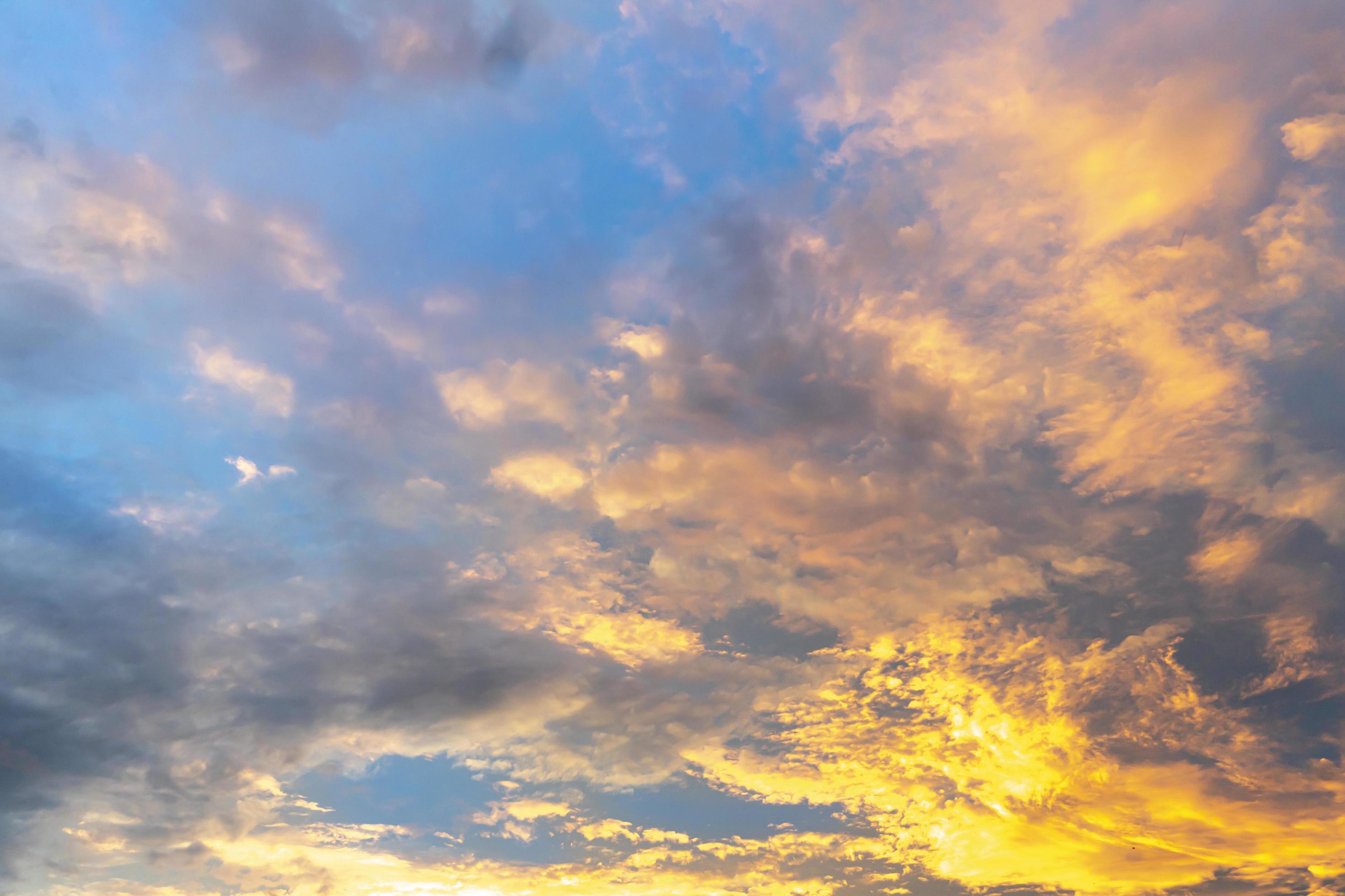 Golden clouds in the morning. Under the blue sky. For nature background. Stock Free