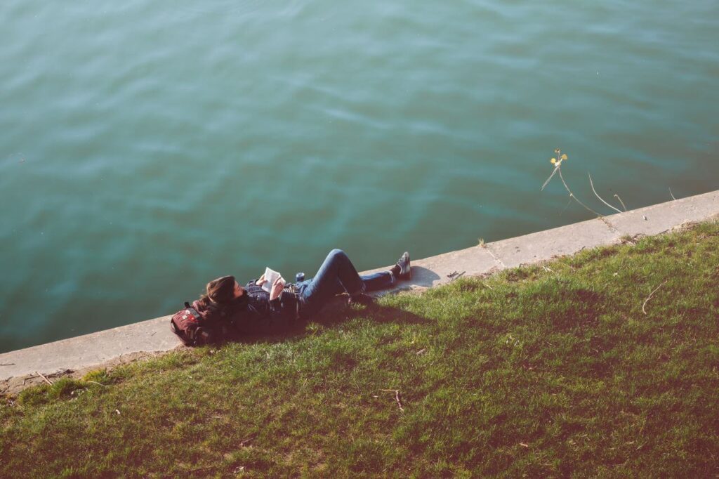 Relaxed Woman Reading River Stock Free