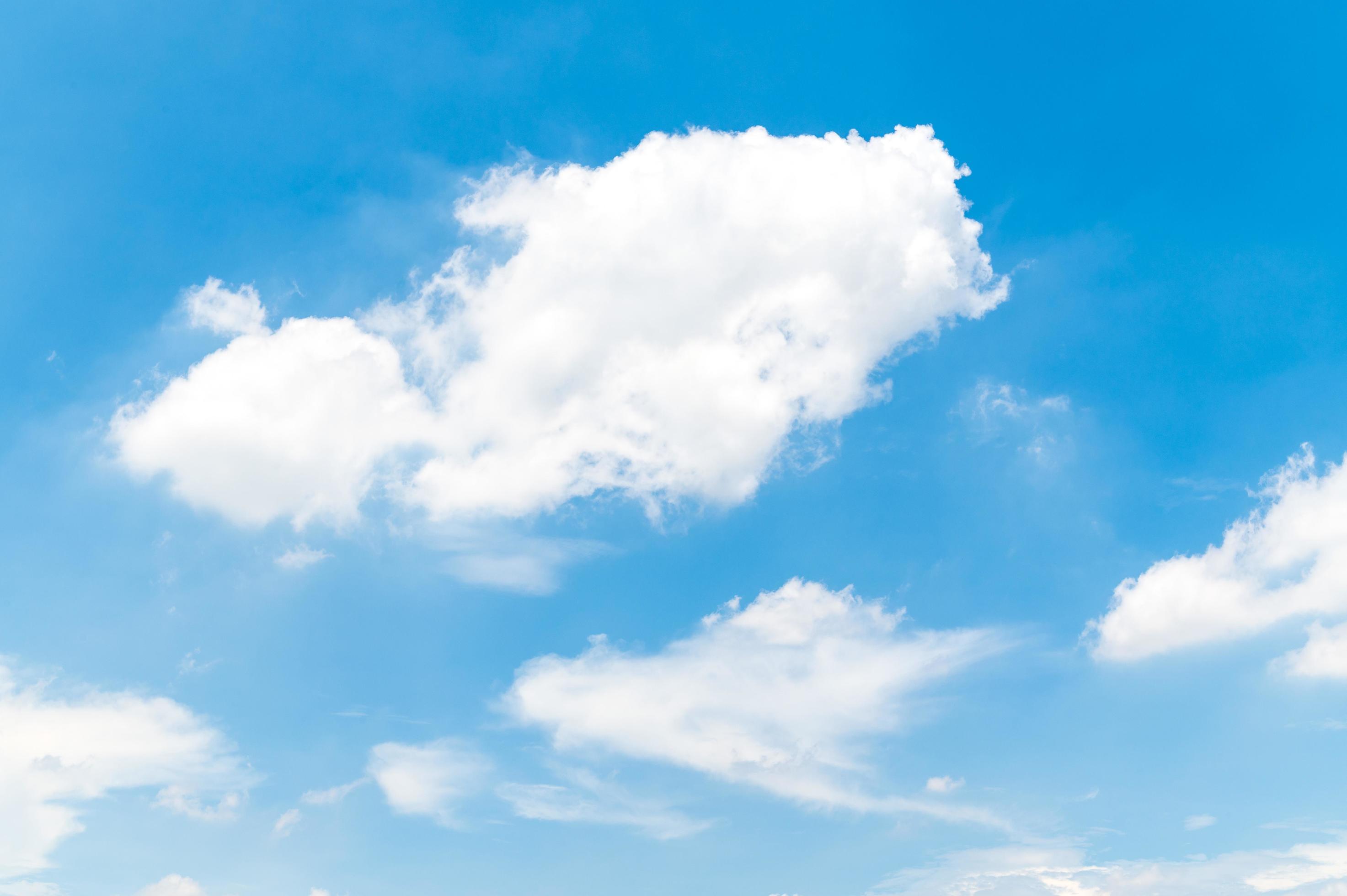 Beautiful white fluffy clouds in blue sky. Nature background from white clouds in sunny day Stock Free