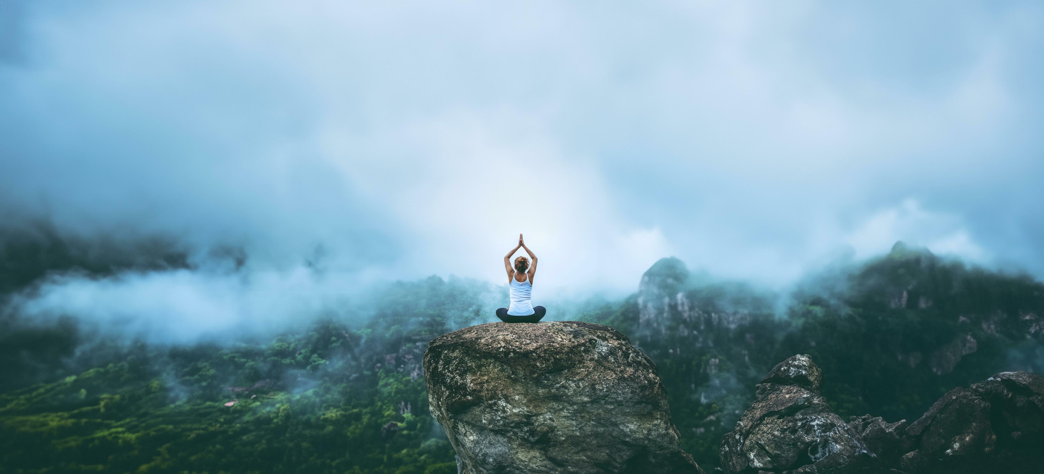 Asian woman relax in the holiday. Play if yoga. On the Moutain r Stock Free