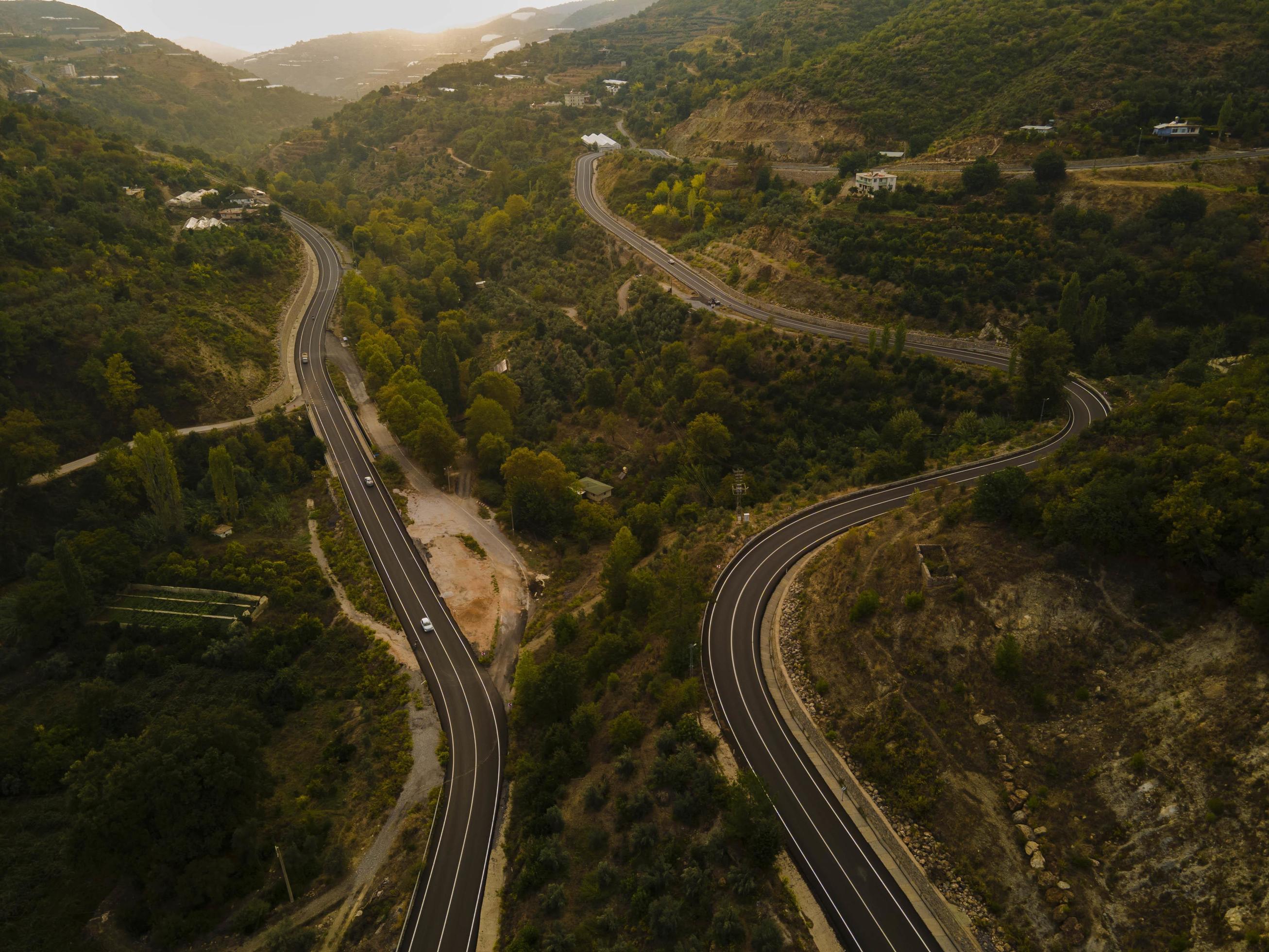 aerial valley and road, Top view, amazing nature background. sunset Flying drone, seascape Stock Free