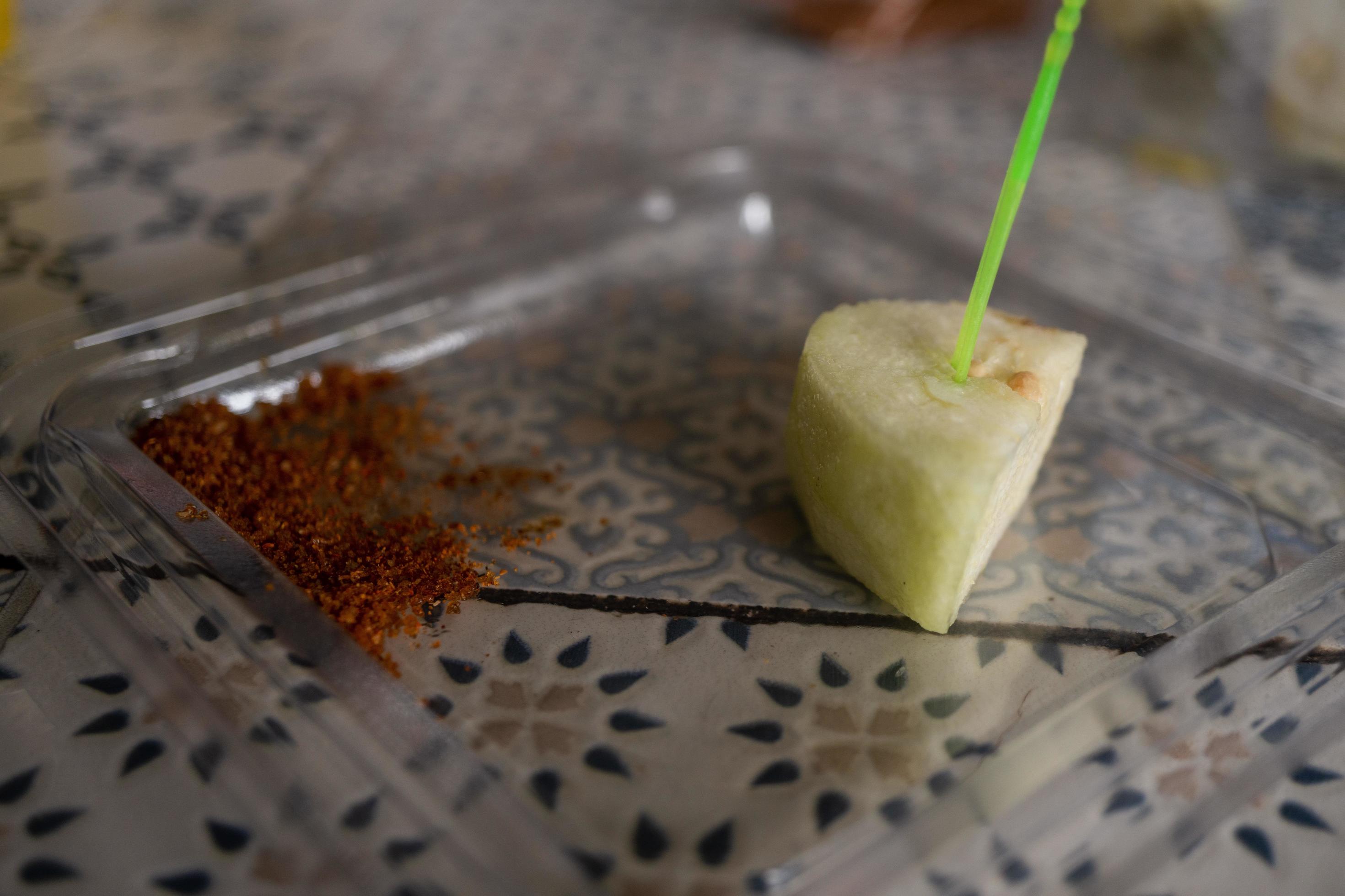 Traditional fruit salad with chili powder on the cafe shop. The photo is suitable to use for traditional food background, poster and food content media. Stock Free