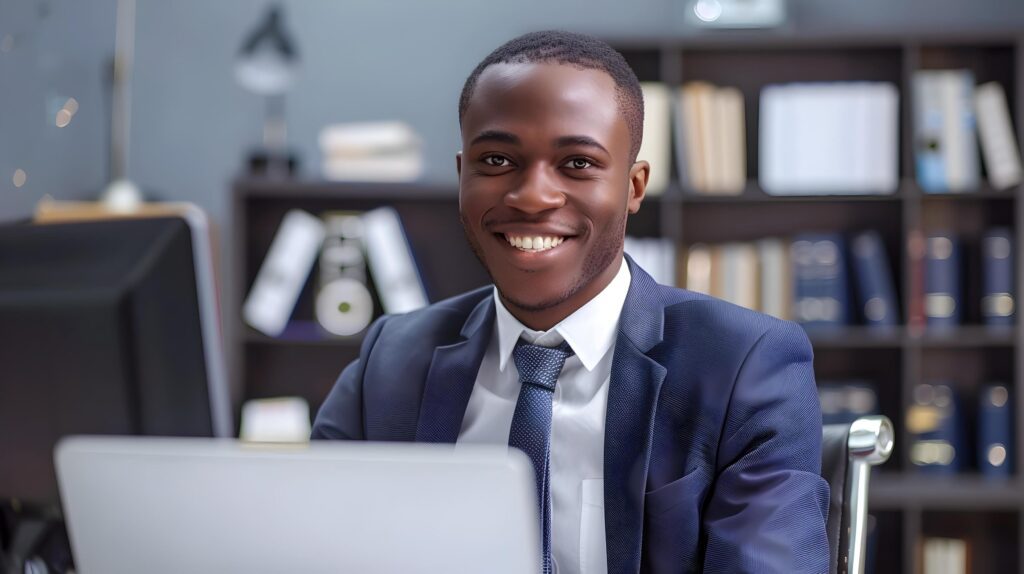 Confident Young Business Professional in Suit Working at Office Desk Stock Free