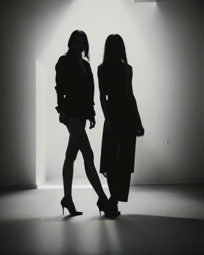 Silhouette of three women in black and white dresses, studio shot. ai generative Free Photo