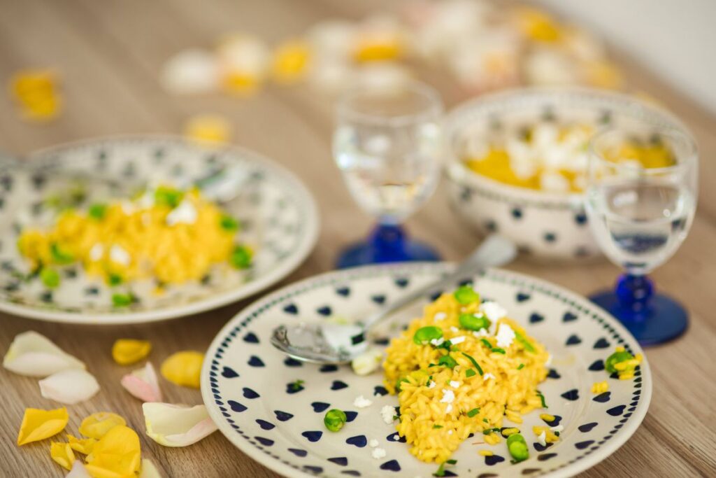 Risotto with broad bean on a cute plate with blue hearts Stock Free