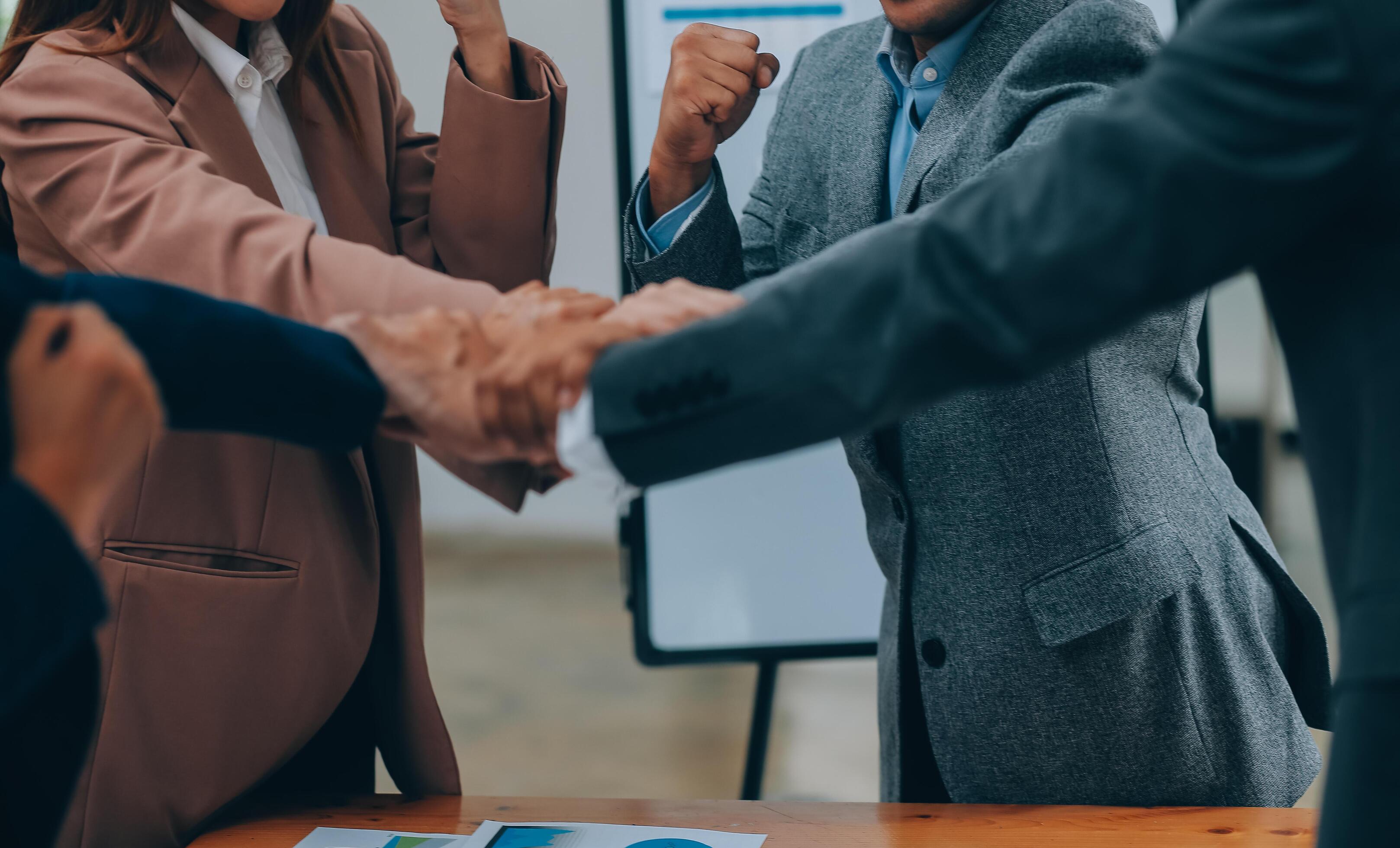 Business people join hand together during their meeting Stock Free