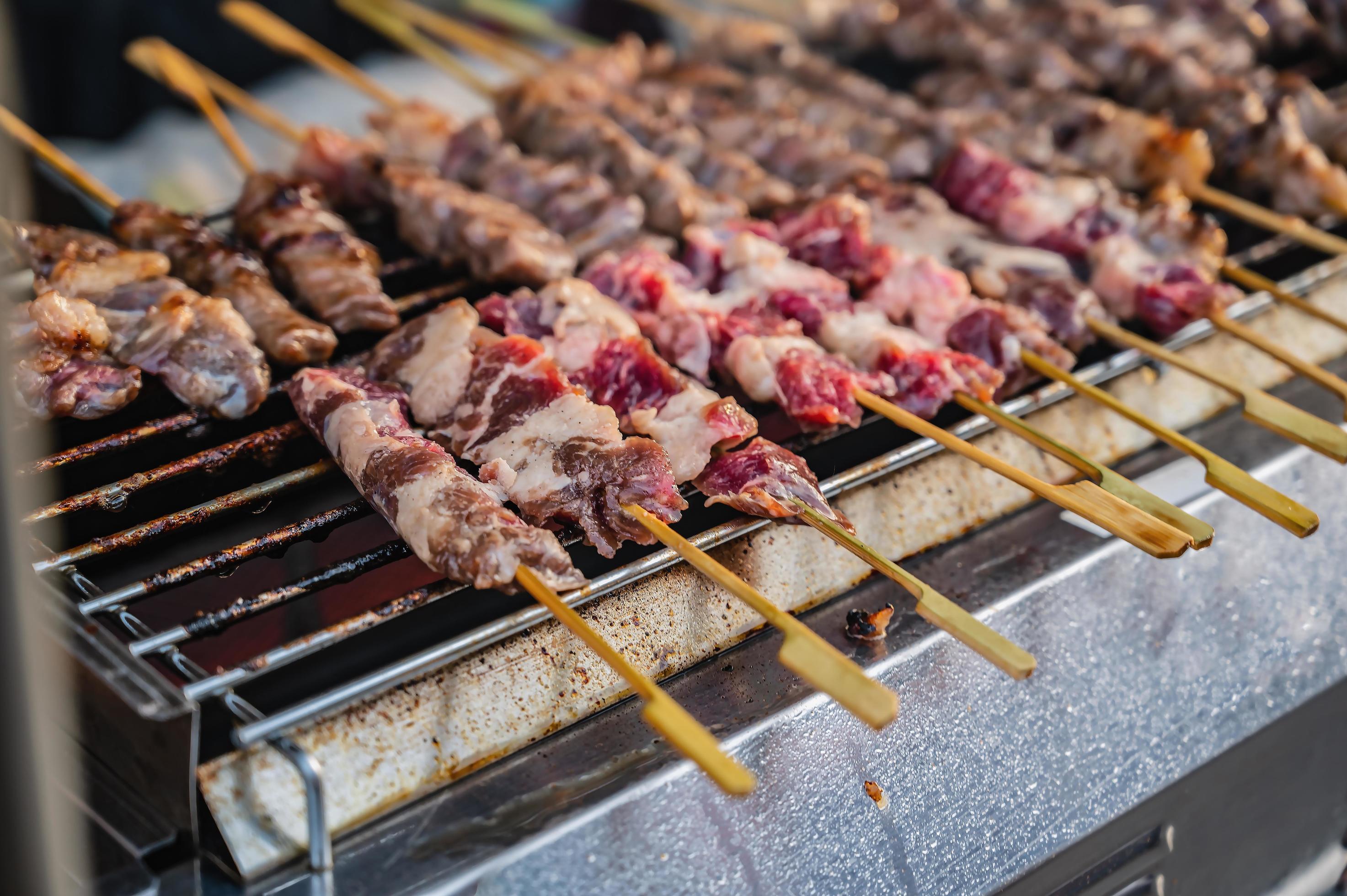 Close up raw beef skewers on the stove.Street food on the walking street Stock Free