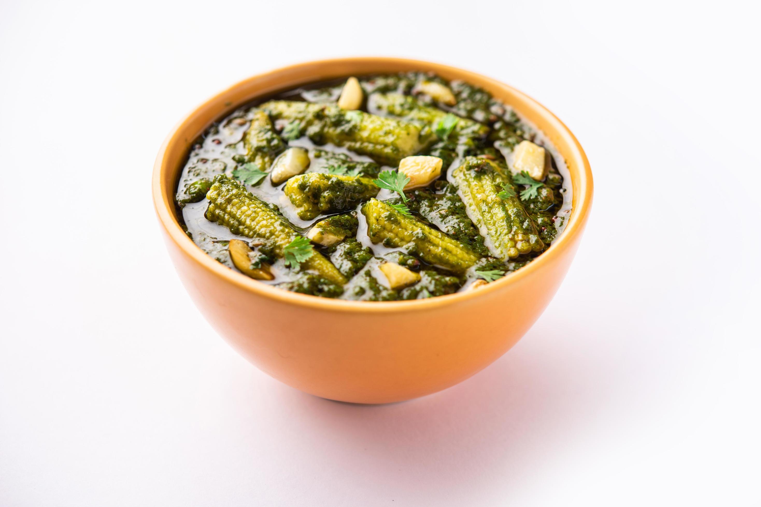 palak baby corn sabzi also known as spinach makai curry served with rice or roti, Indian food Stock Free