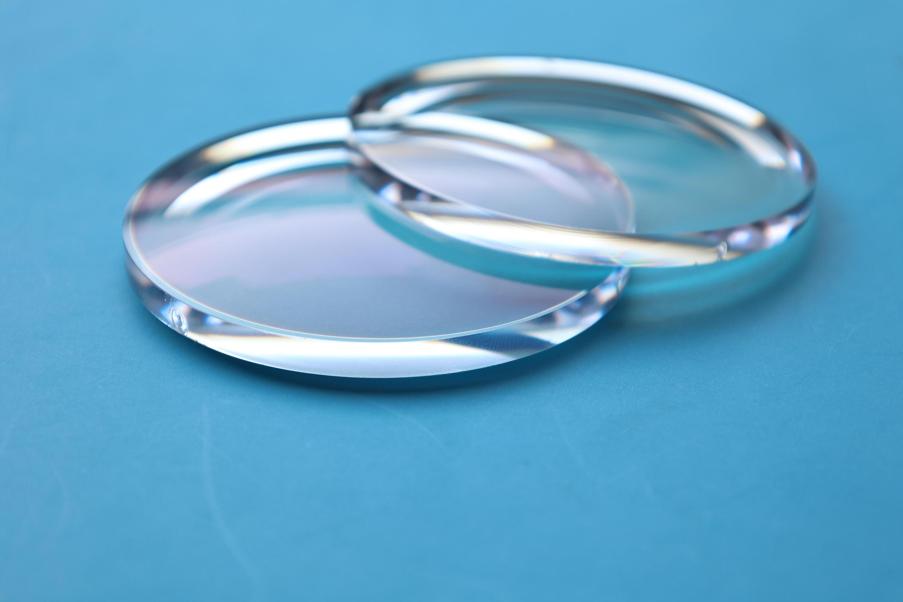 Eyeglasses lens production industry, close-up eyeglasses lenses, eyeglasses lenses, eyeglasses lenses, eyeglasses store business concept Stock Free