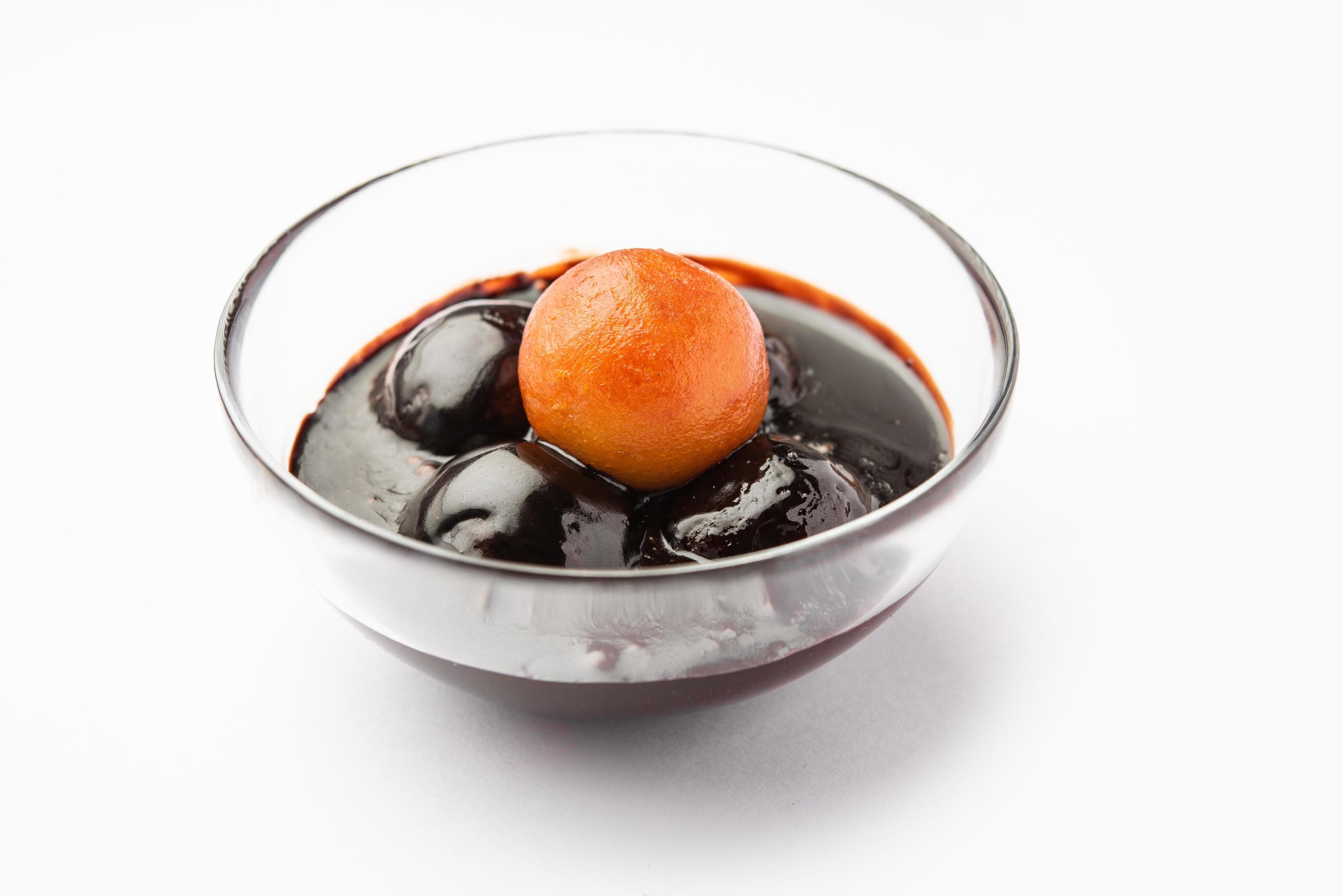 Chocolate dipped gulab jamun, indian creative fusion dessert food Stock Free