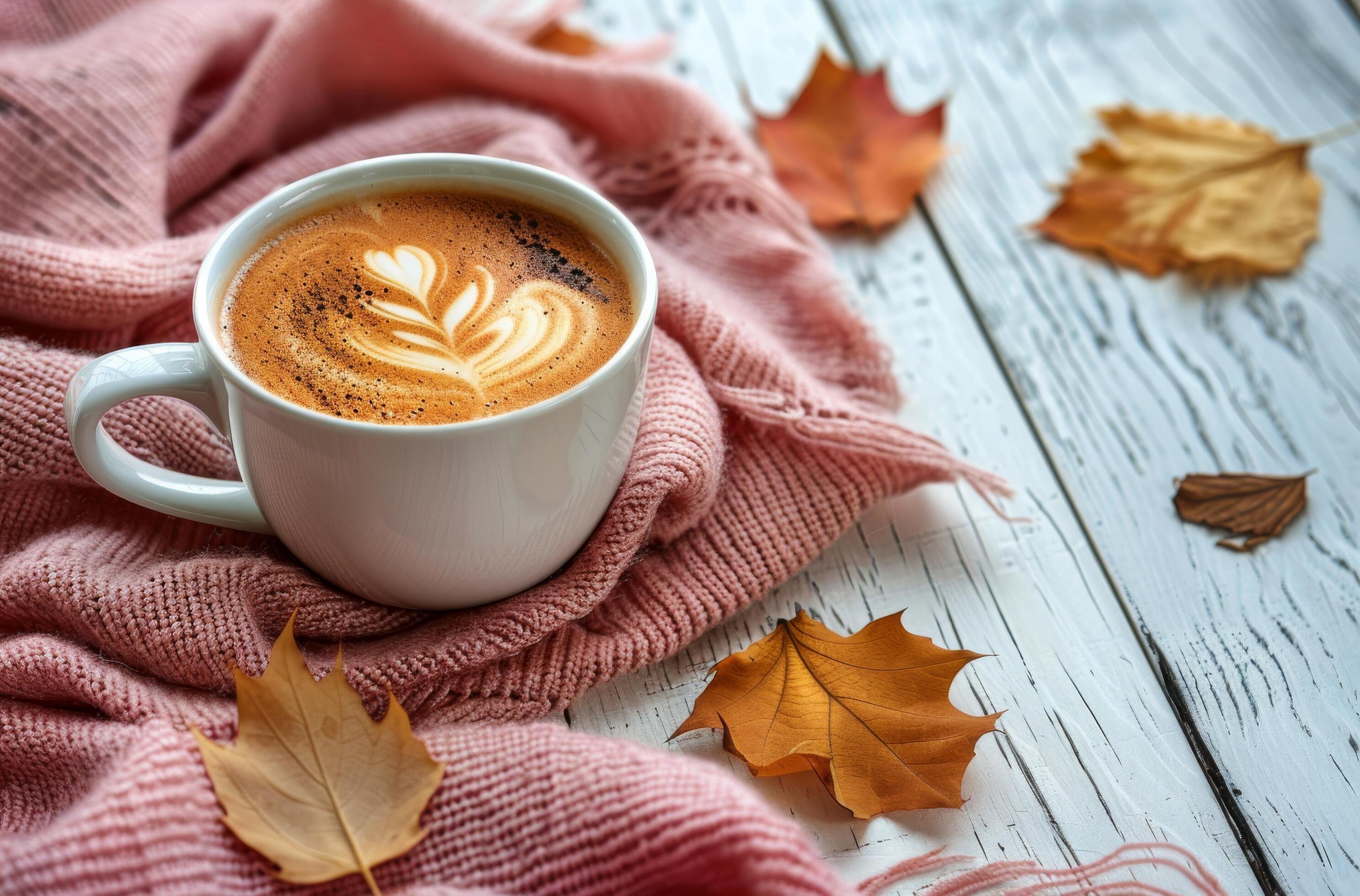 Warm Latte With Autumn Leaves and Blanket on White Wooden Table Stock Free