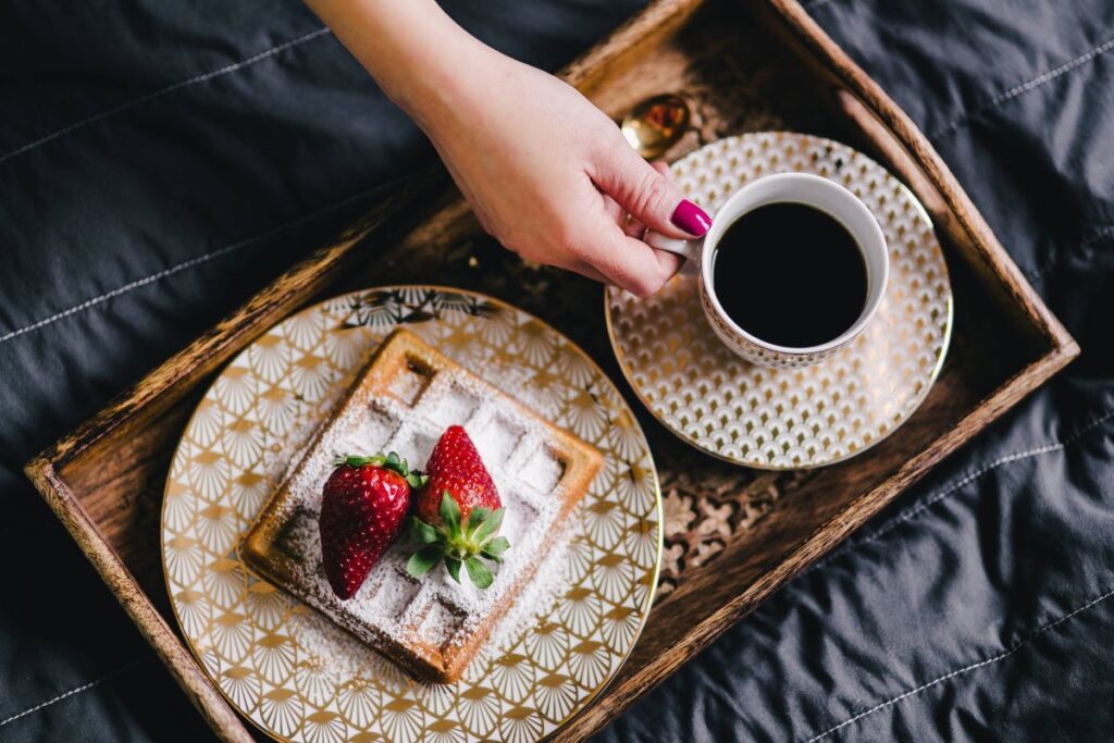 Saffle with strawberries and cup of coffee Stock Free