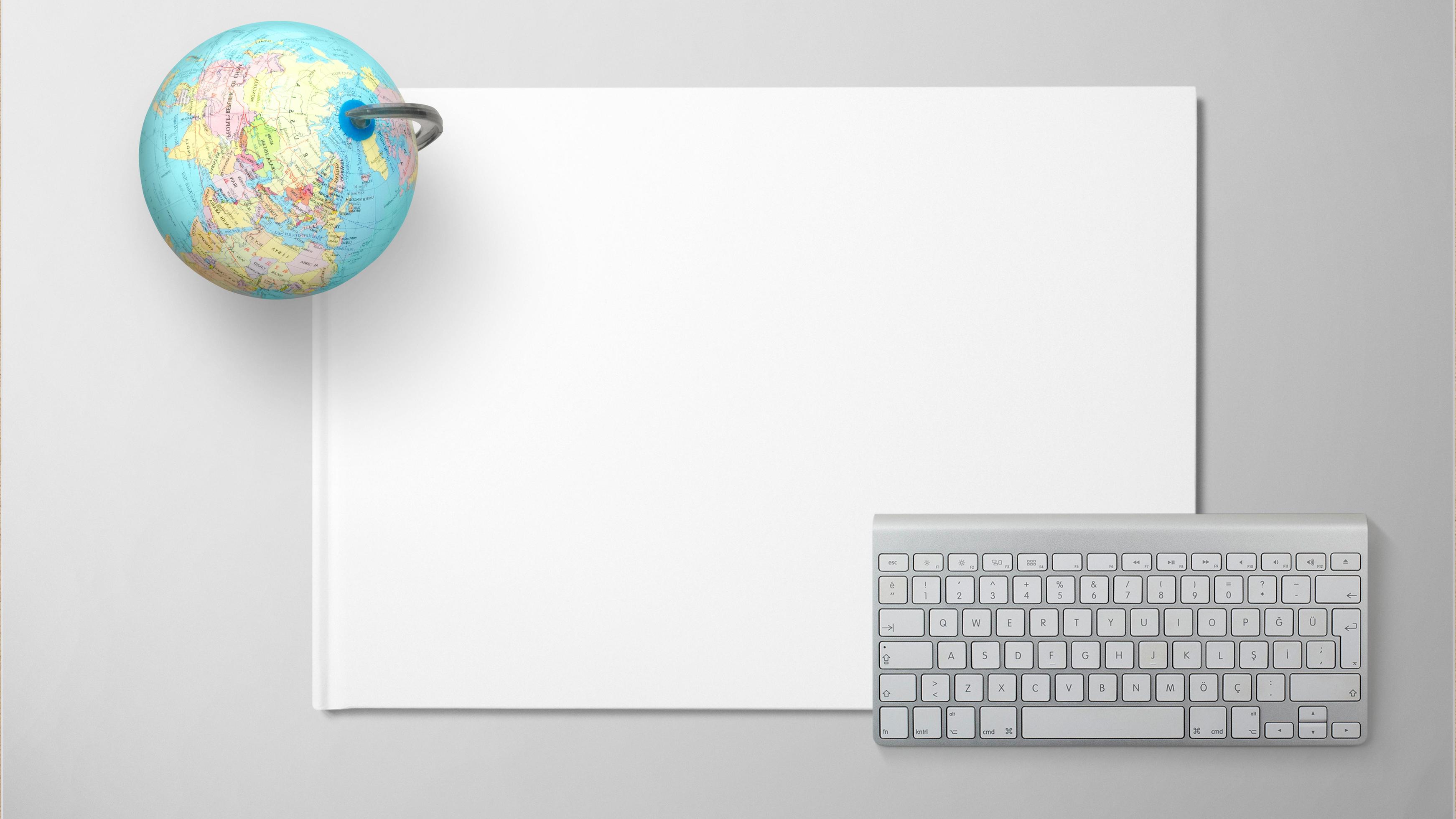 
									Globe with computer keyboard on white paper on isolated background Stock Free