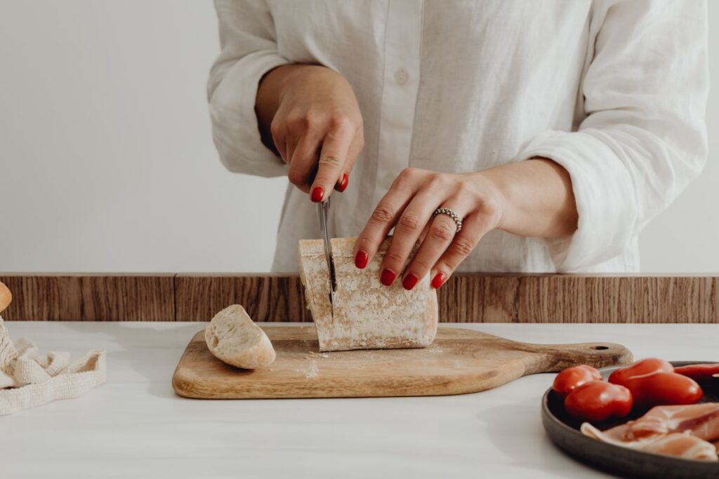 Woman making bruschetta with healthy ingredients Stock Free