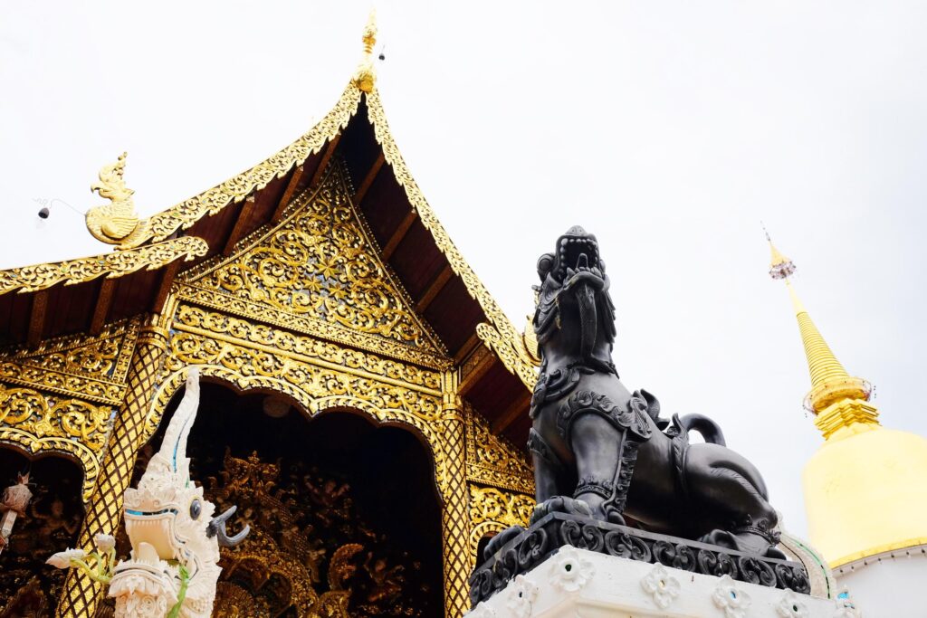 Heritage Golden and white sanctuary and chapel in the temple of lanna style at Chiangmai province, Thailand Stock Free