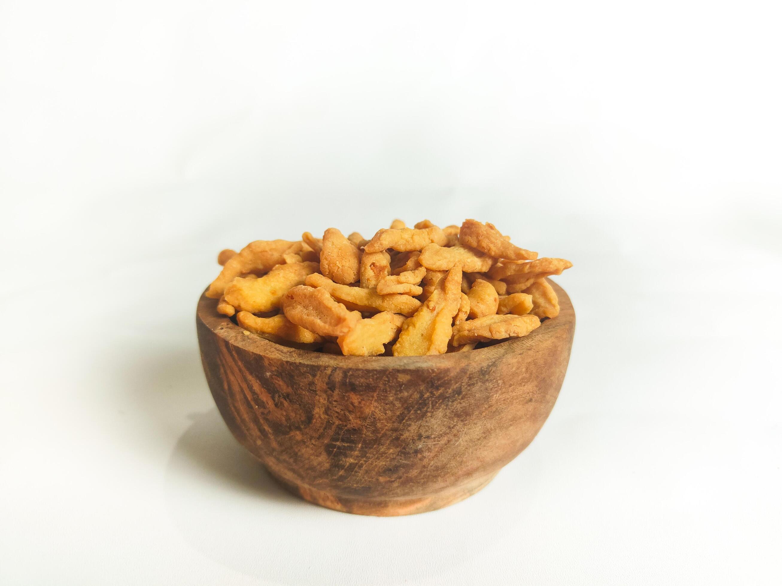 photography of cimi-cimi snack food in a wooden bowl on a white background Stock Free