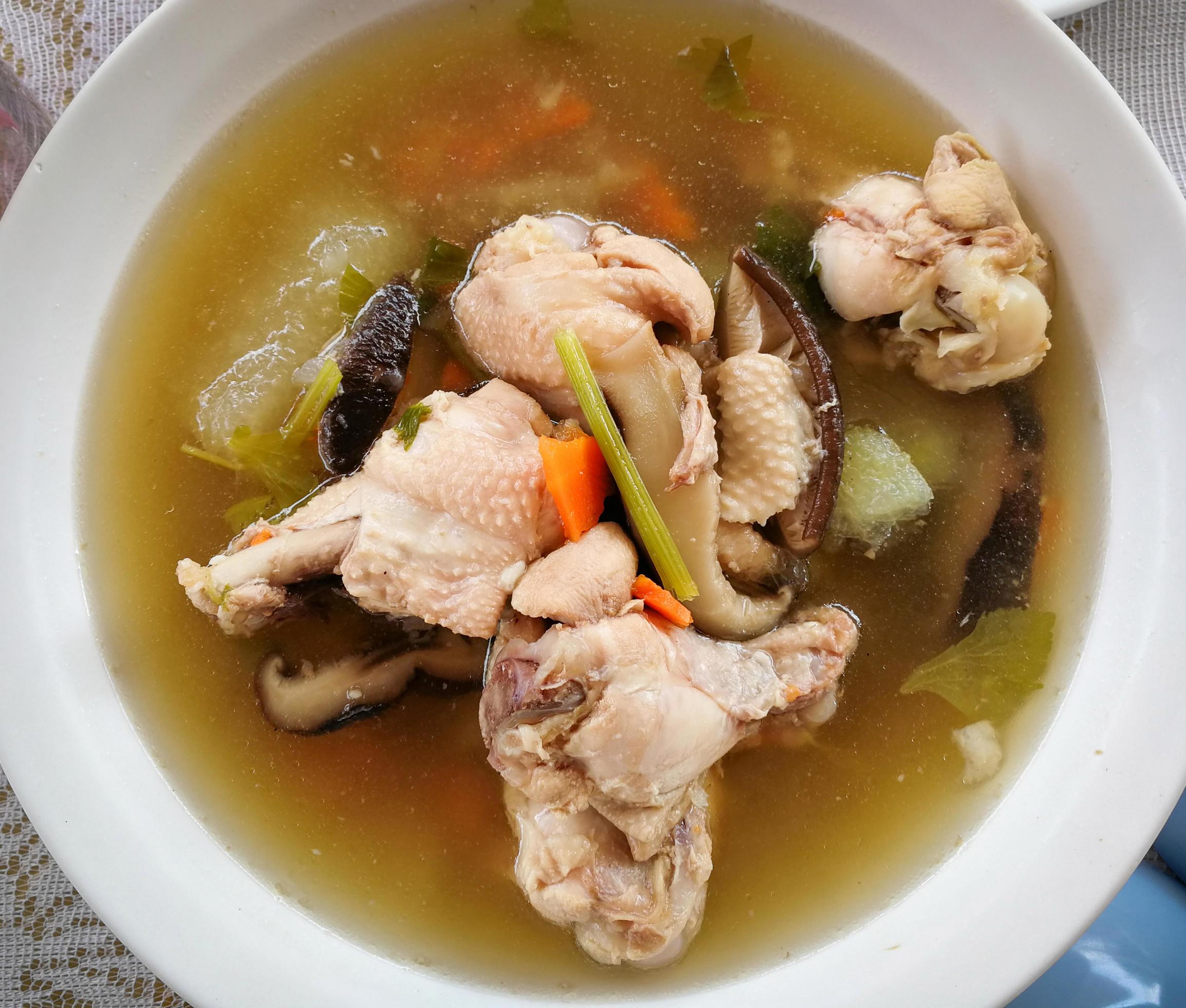 chicken soup on bowl with carrot mushroom and vegetables homemade cooked food for breakfast Stock Free