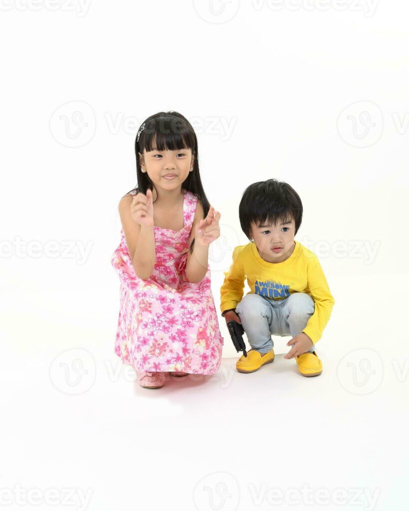 south East Asian brother sister child playing posing on white background Pro Photo