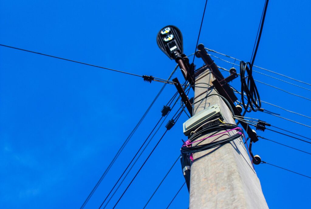 electric pole on blue background Stock Free