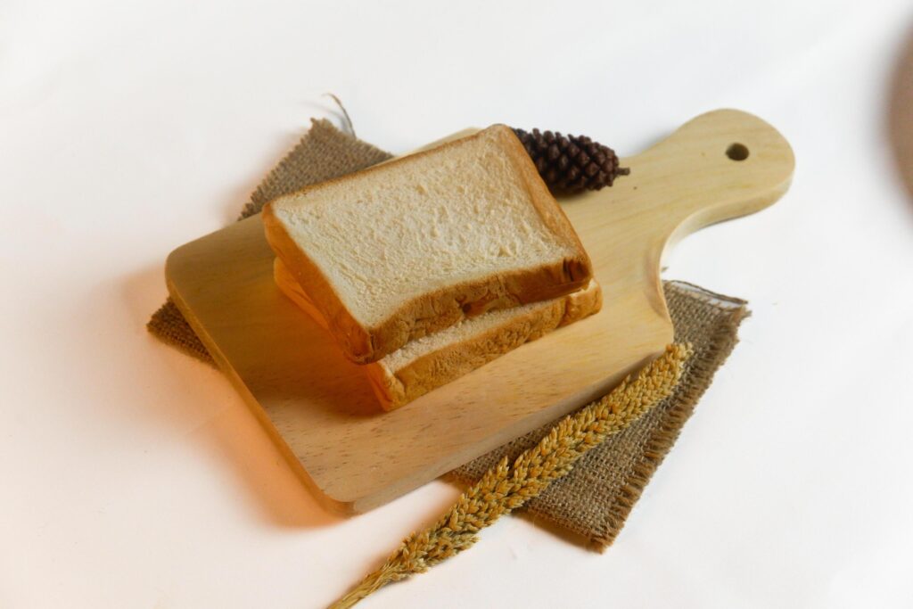 photography of bread with wheat on a white background Stock Free