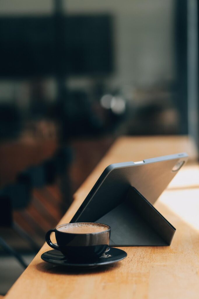 Coffee Cup on the Table with Computer Keyboard for Business Concept. Stock Free