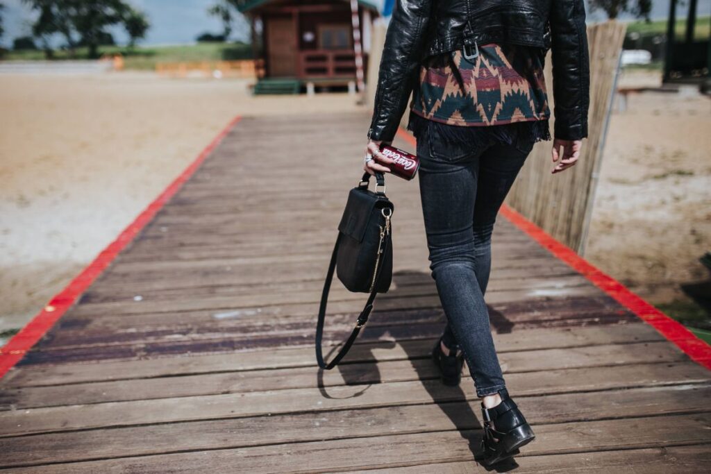 Beautiful blonde woman on a wooden pier by the lake Stock Free