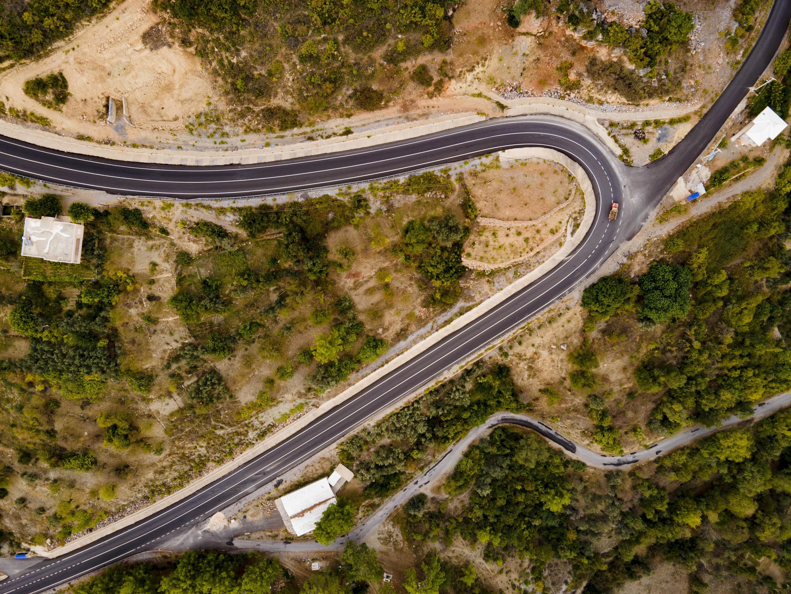 aerial valley and road, Top view, amazing nature background. sunset Flying drone, seascape Stock Free