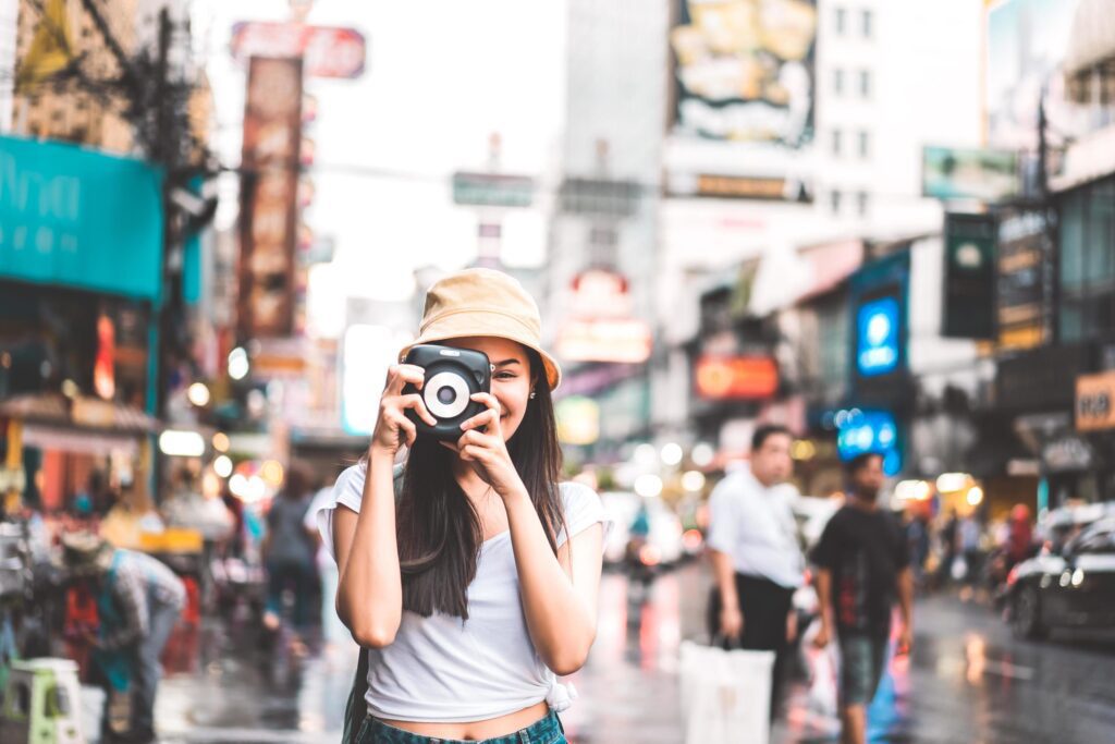 Asian traveler woman with camera at chinatown. Stock Free