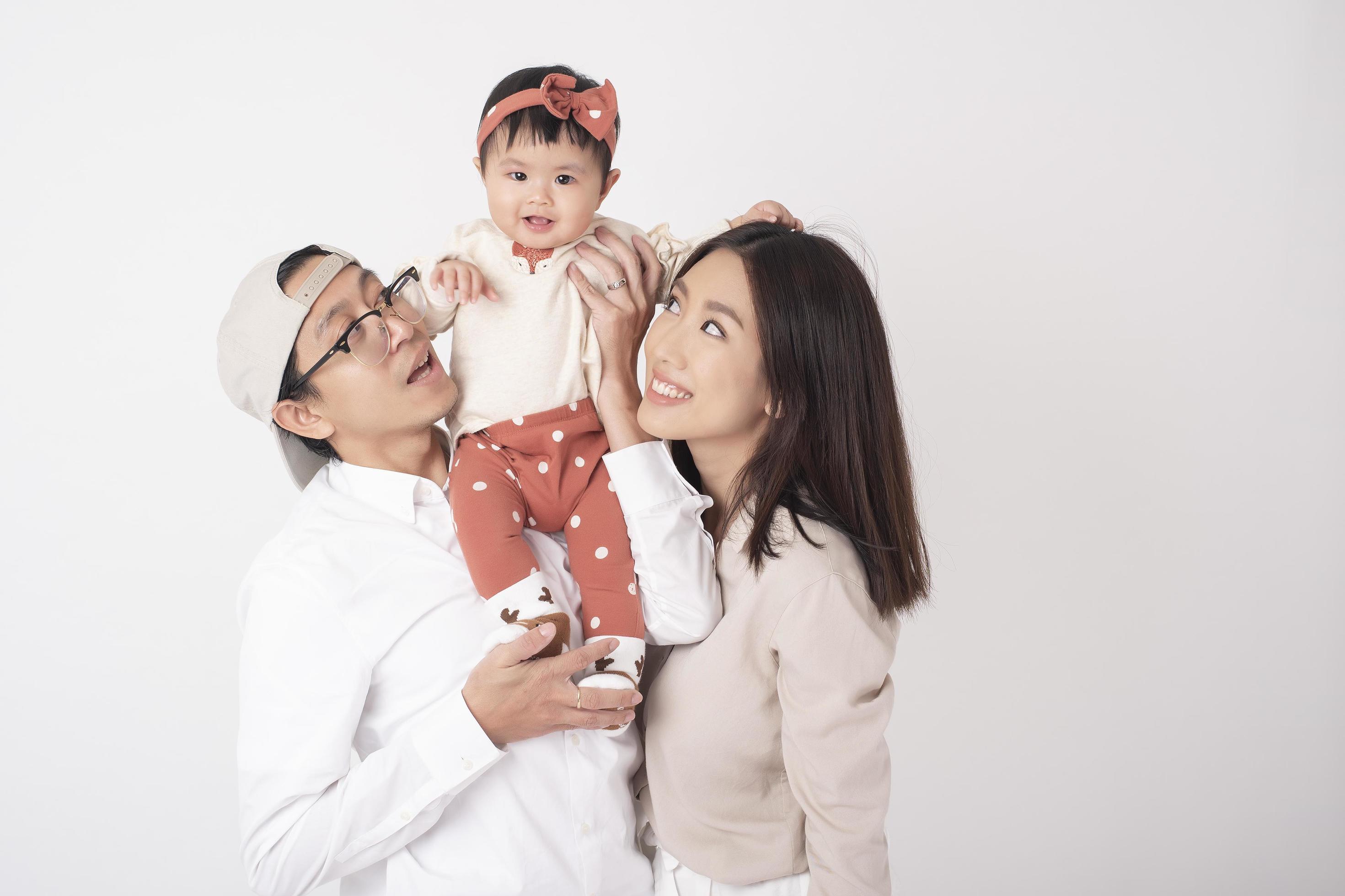 Happy Asian family on white background Stock Free